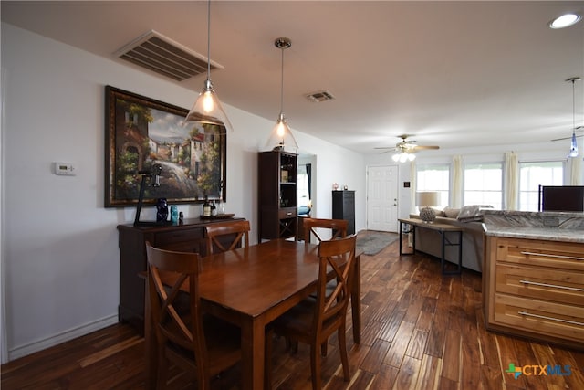 dining space featuring dark hardwood / wood-style floors and ceiling fan