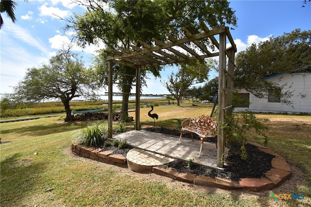 view of yard with a patio and a water view