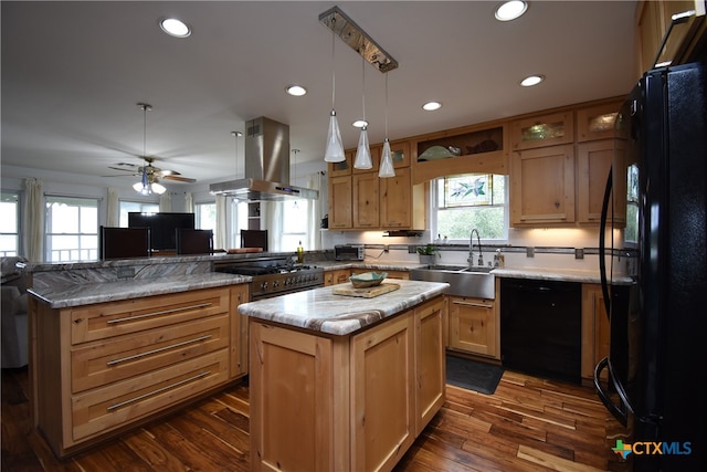 kitchen featuring dark hardwood / wood-style flooring, black appliances, sink, island exhaust hood, and a kitchen island