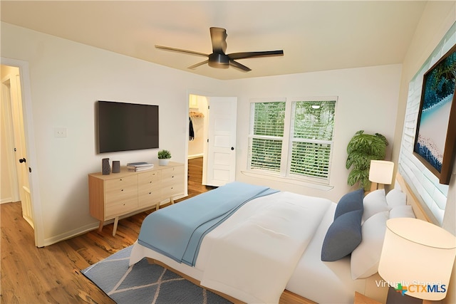 921 N 10th St, Temple, TX 76501 - bedroom with light wood-style floors and a ceiling fan