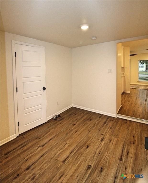 921 N 10th St, Temple, TX 76501 - spare room with dark wood-style floors and baseboards