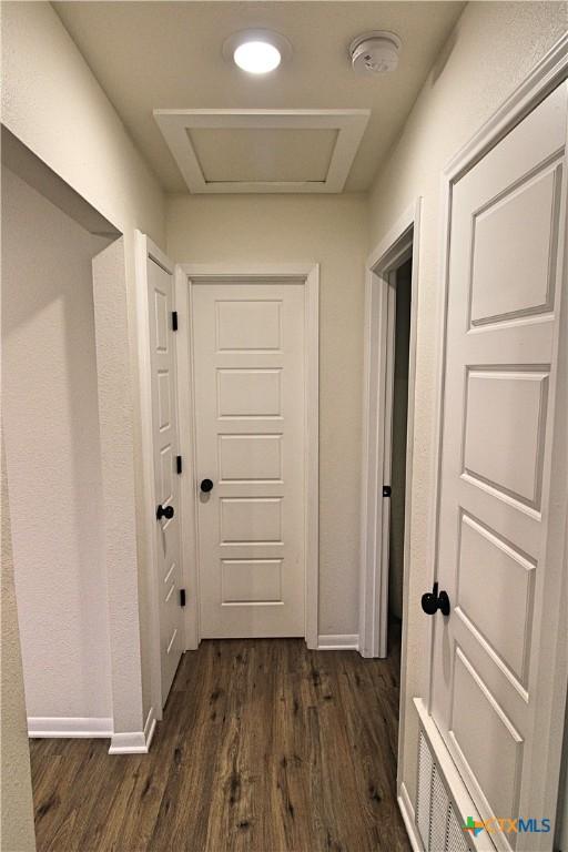 921 N 10th St, Temple, TX 76501 - hall featuring dark wood finished floors and baseboards