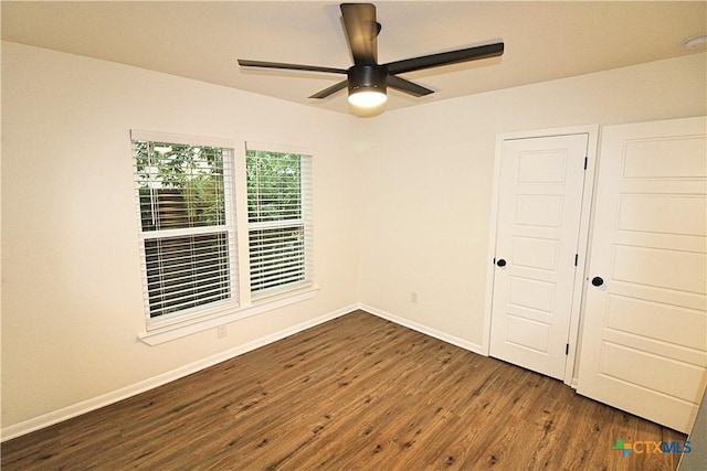 921 N 10th St, Temple, TX 76501 - unfurnished room featuring a ceiling fan and dark wood-type flooring