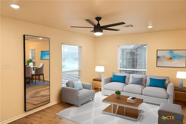 921 N 10th St, Temple, TX 76501 - living room with healthy amount of natural light, wood finished floors, ceiling fan, and recessed lighting