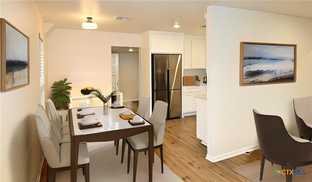 921 N 10th St, Temple, TX 76501 - dining space featuring light wood-type flooring and recessed lighting
