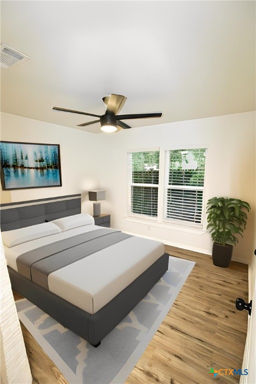 921 N 10th St, Temple, TX 76501 - bedroom featuring wood finished floors and a ceiling fan