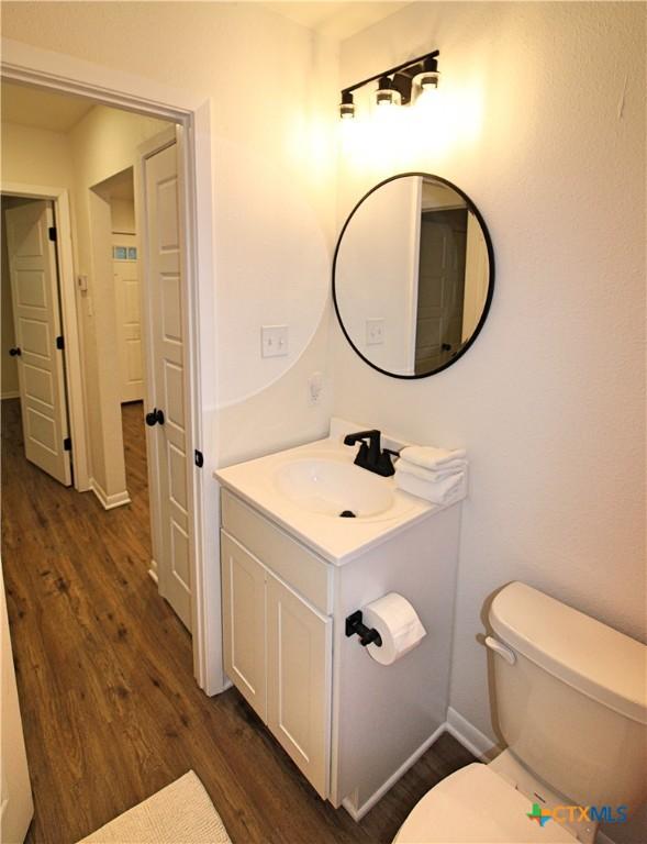 921 N 10th St, Temple, TX 76501 - bathroom with wood finished floors and vanity