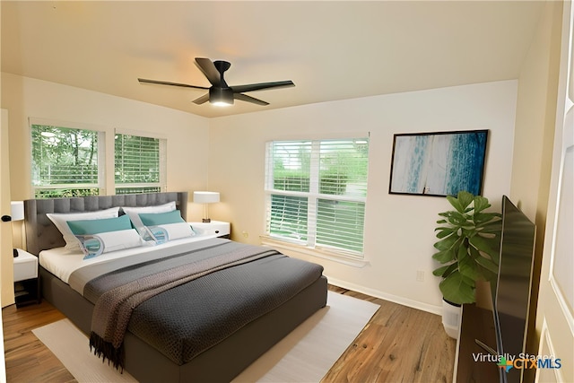 921 N 10th St, Temple, TX 76501 - bedroom with wood finished floors, multiple windows, and ceiling fan