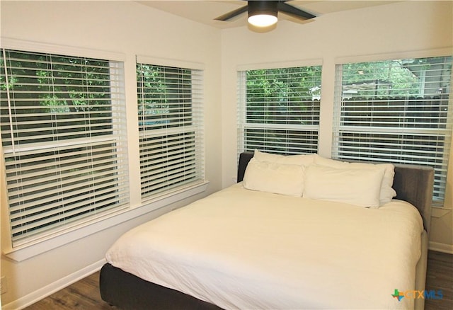 921 N 10th St, Temple, TX 76501 - bedroom featuring dark wood-style flooring and a ceiling fan
