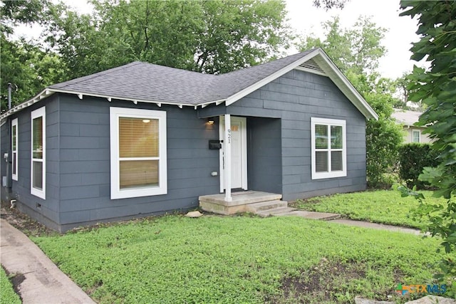 921 N 10th St, Temple, TX 76501 - view of front of property with a shingled roof and a front yard