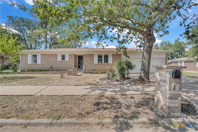 single story home featuring a garage