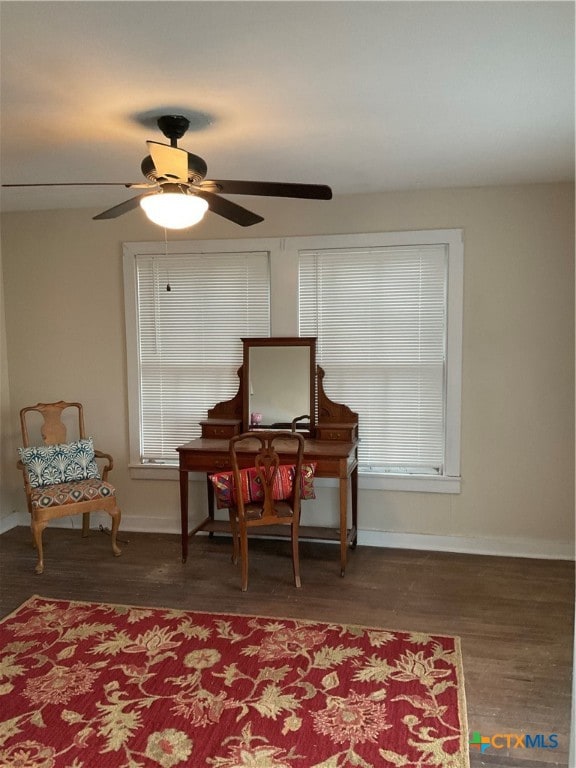 sitting room with dark hardwood / wood-style flooring, ceiling fan, and plenty of natural light