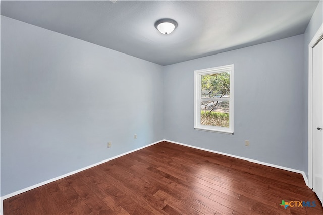 unfurnished room featuring hardwood / wood-style floors