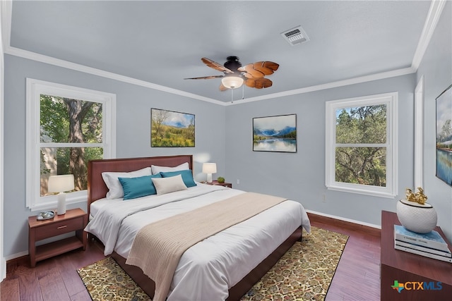 bedroom with ceiling fan, dark hardwood / wood-style floors, and crown molding