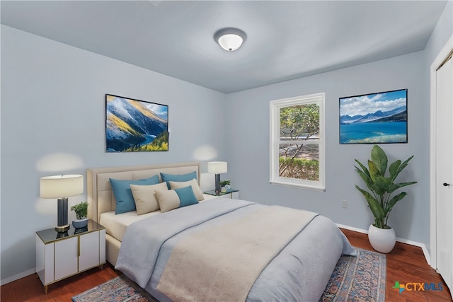 bedroom featuring dark hardwood / wood-style floors