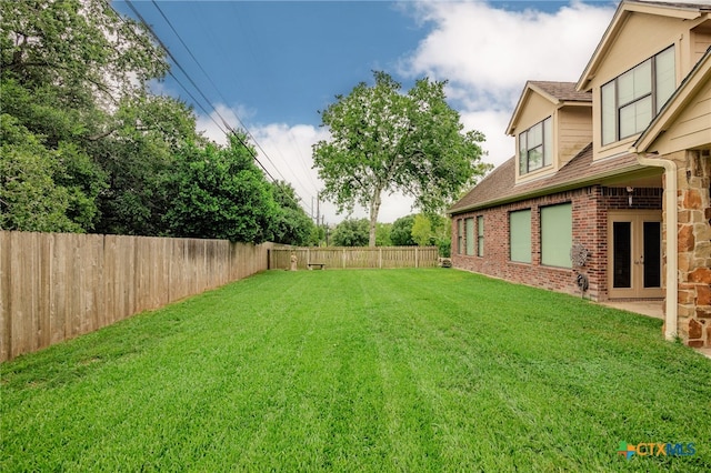 view of yard featuring french doors