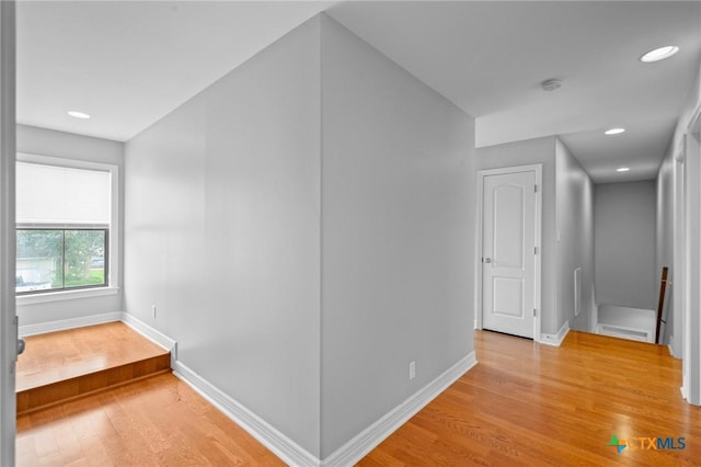 26 Cotswold Ln, Victoria, TX 77904 - corridor featuring an upstairs landing, light wood-type flooring, and recessed lighting