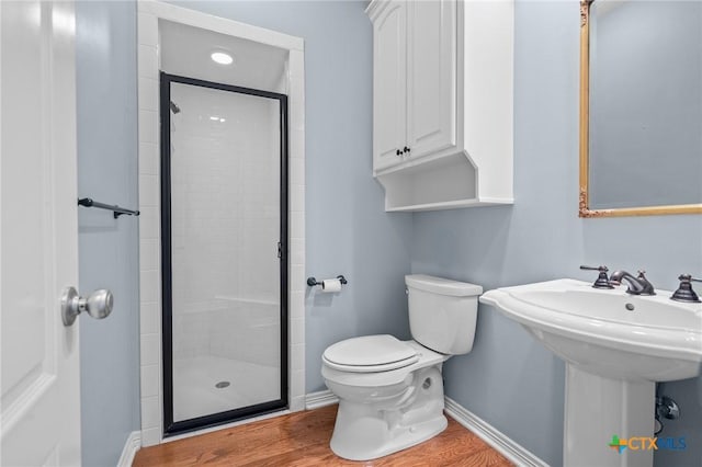 26 Cotswold Ln, Victoria, TX 77904 - bathroom featuring a stall shower and wood finished floors
