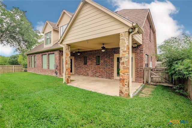 26 Cotswold Ln, Victoria, TX 77904 - back of house with ceiling fan, a patio area, a fenced backyard, brick siding, and roof with shingles