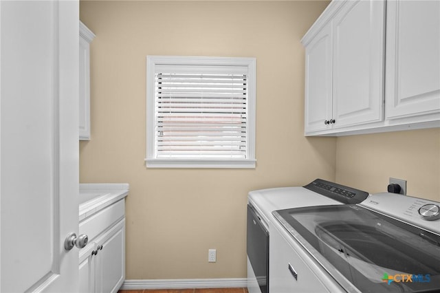 26 Cotswold Ln, Victoria, TX 77904 - laundry area with independent washer and dryer and cabinet space