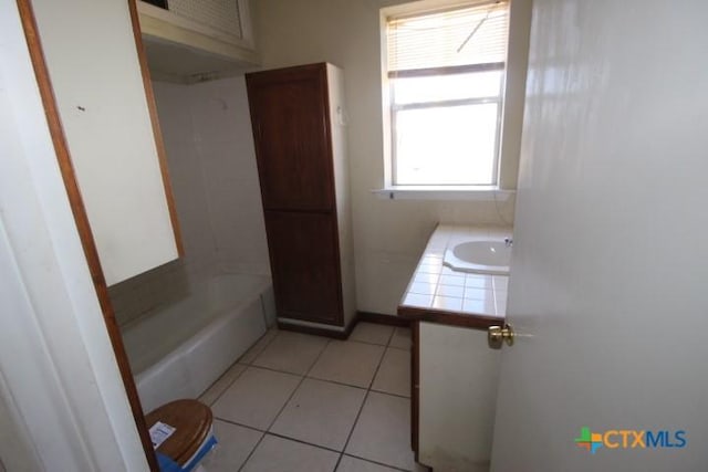 full bathroom with tile patterned flooring and vanity