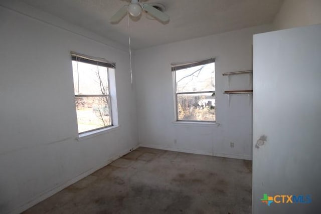 spare room with ceiling fan