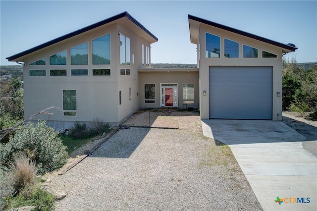 1550 Moon View Dr, New Braunfels, TX 78132 - modern home with stucco siding and concrete driveway