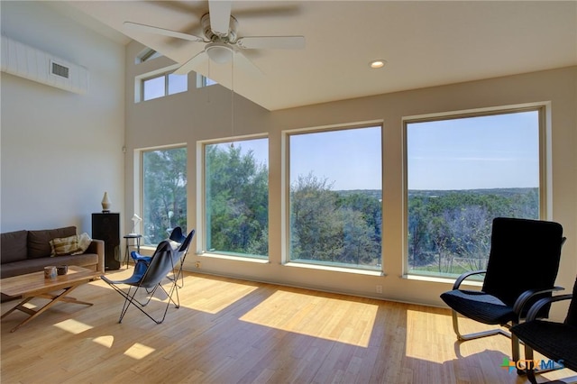 1550 Moon View Dr, New Braunfels, TX 78132 - sunroom / solarium featuring recessed lighting, a high ceiling, and wood finished floors