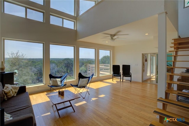 1550 Moon View Dr, New Braunfels, TX 78132 - living area featuring ceiling fan, stairs, recessed lighting, a high ceiling, and wood finished floors