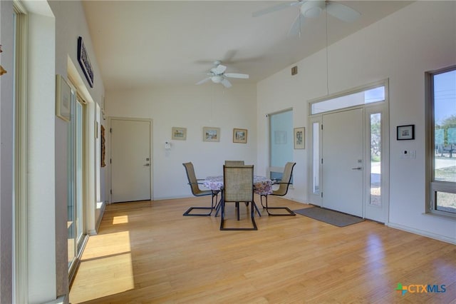 1550 Moon View Dr, New Braunfels, TX 78132 - dining room with high vaulted ceiling, light wood-style floors, and ceiling fan