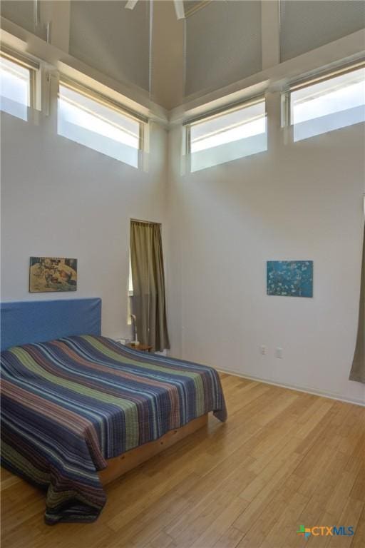 1550 Moon View Dr, New Braunfels, TX 78132 - bedroom with a high ceiling and wood finished floors