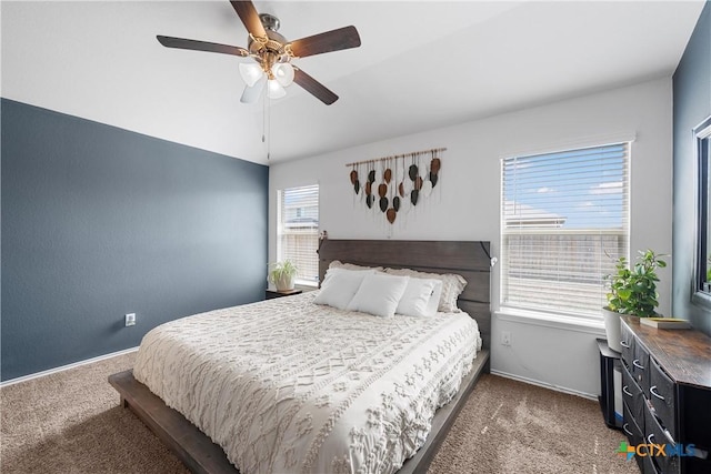 bedroom with multiple windows, carpet floors, and ceiling fan