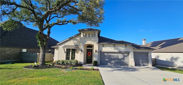 633 Vale Ct, New Braunfels, TX 78132 - view of front facade featuring a garage, driveway, stone siding, and a front yard