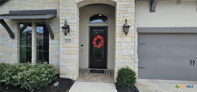 633 Vale Ct, New Braunfels, TX 78132 - property entrance with stone siding and a garage