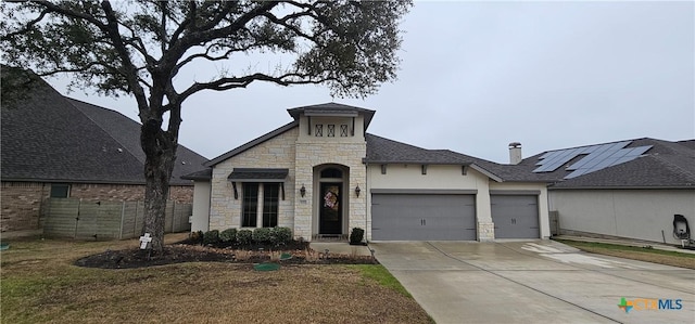 633 Vale Ct, New Braunfels, TX 78132 - french country inspired facade with stone siding, an attached garage, concrete driveway, and a shingled roof