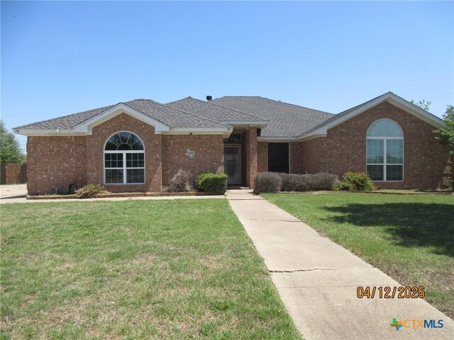 2010 Purple Martin Dr, Killeen, TX 76542 - ranch-style house featuring a front yard and brick siding