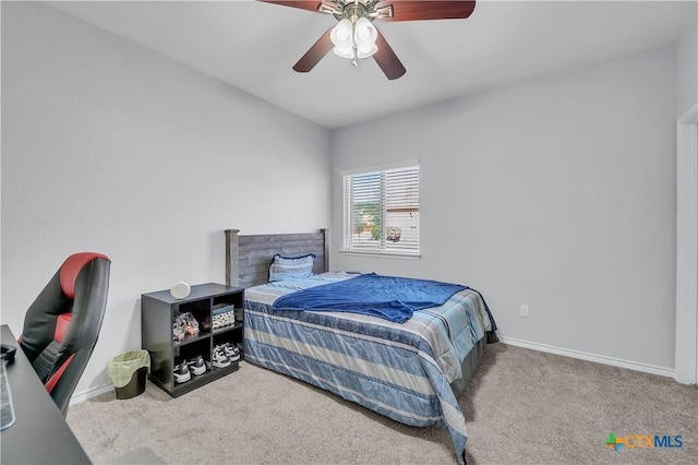 bedroom featuring carpet flooring, a ceiling fan, and baseboards