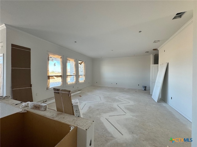 empty room featuring ornamental molding