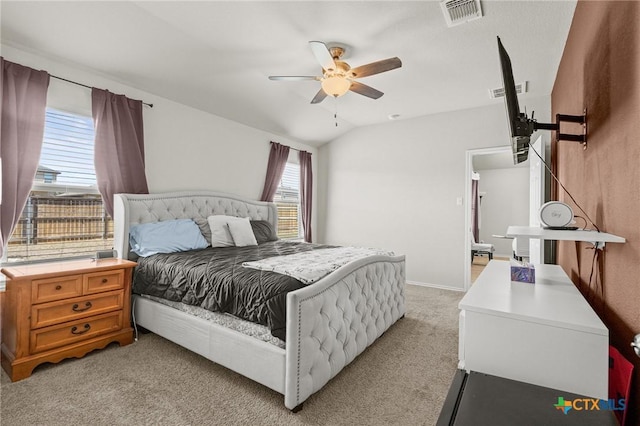 bedroom featuring visible vents, light colored carpet, a ceiling fan, and vaulted ceiling