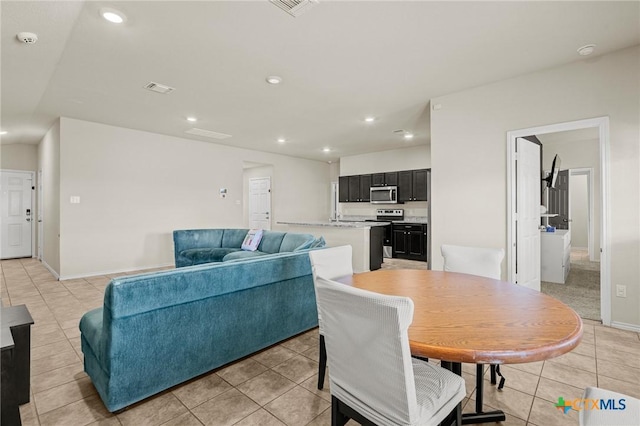 dining space featuring light tile patterned floors, visible vents, recessed lighting, and baseboards