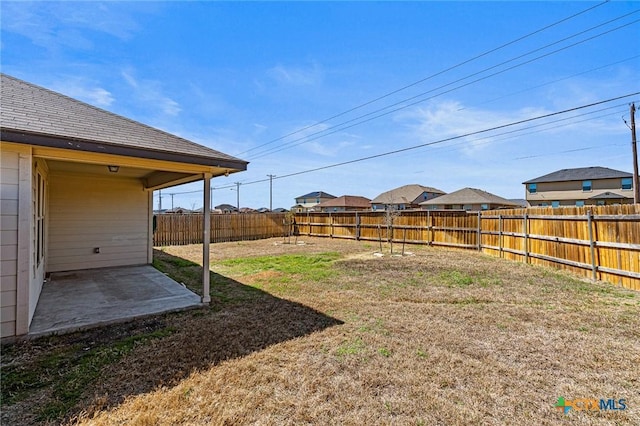 view of yard featuring a patio and a fenced backyard