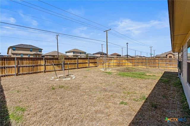 view of yard featuring a fenced backyard