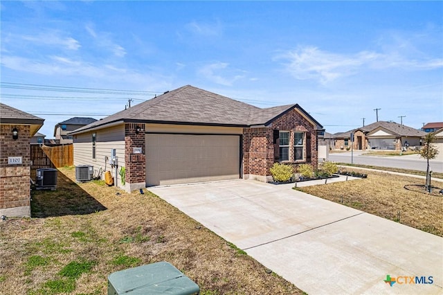 ranch-style house featuring fence, concrete driveway, a garage, central air condition unit, and brick siding