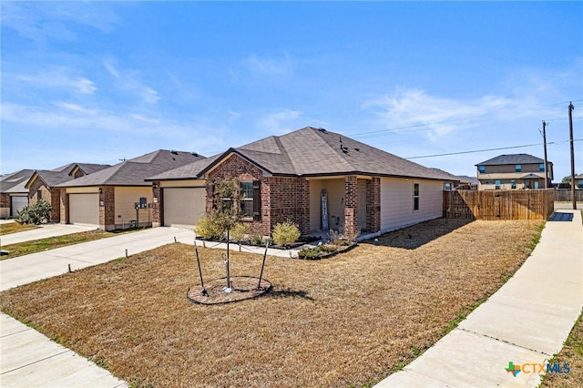 view of front facade featuring a garage, brick siding, concrete driveway, and fence