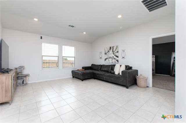 tiled living room with vaulted ceiling