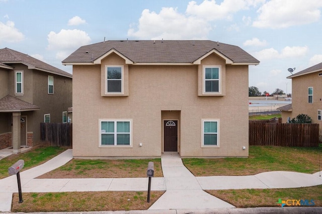 view of front of home featuring a front lawn