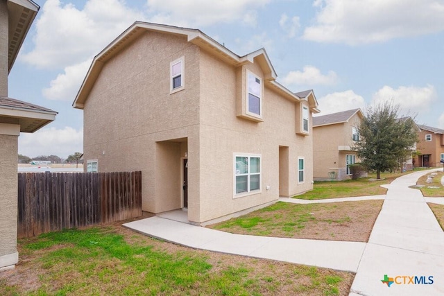 view of property exterior with a lawn