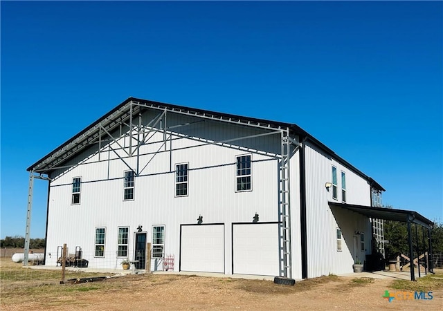 back of property with a garage