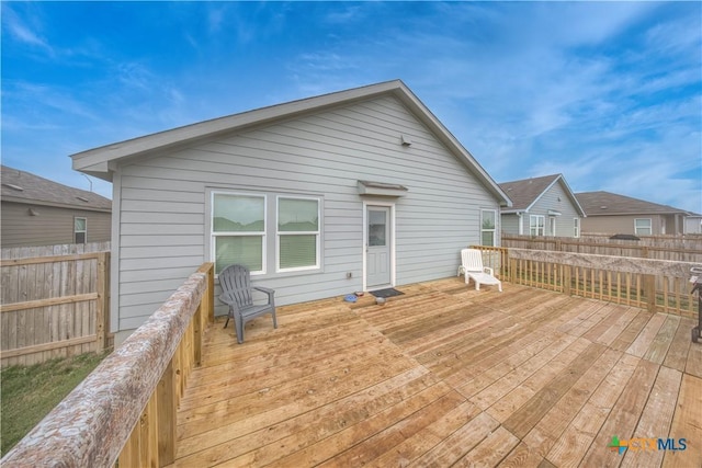 wooden deck featuring fence