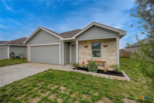 ranch-style home with fence, an attached garage, stone siding, driveway, and a front lawn